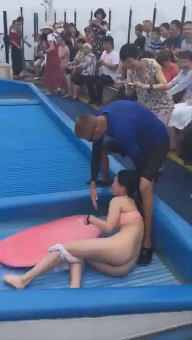 Girl loses bikini top on waterslide